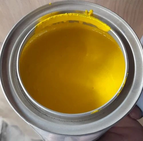 Yellow screen printing ink in an open container